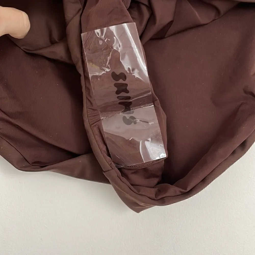 SKIMS SWIM BIKINI bottoms in chocolate brown